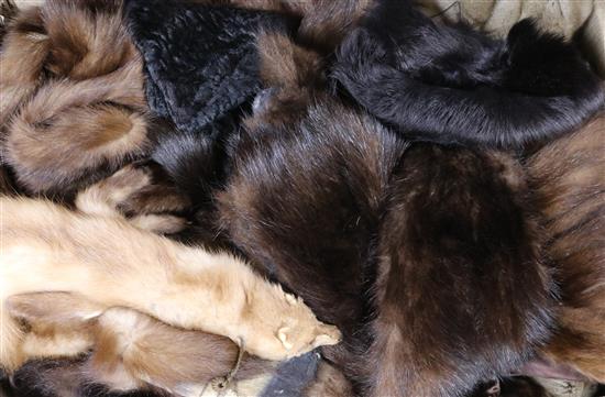 A collection of fur coats, stoles and hats